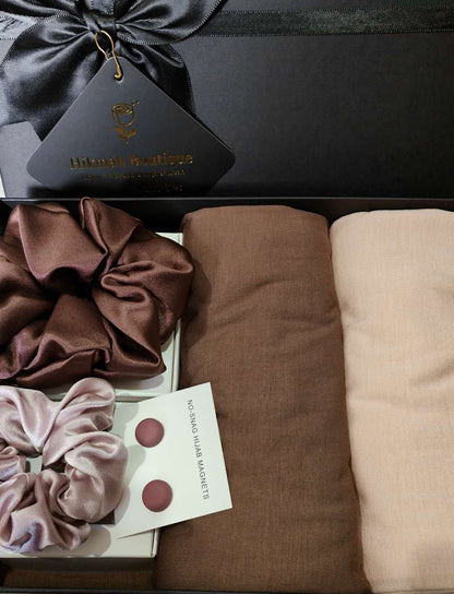 Introducing the Hikmah Boutique exclusive Bamboo Hijab Gift Box - The Tan Set, a luxurious gift box that is perfect for any Hijabi woman. Made with premium quality pure bamboo material, this gift box includes two hijabs in beautiful and sophisticated chocolate brown and nude colors. Includes matching hijab accessories. 
