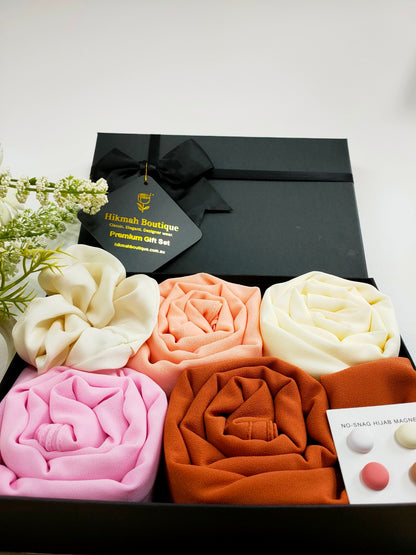 Introducing the Hijab Gift Box - The Blossom Set by Hikmah Boutique, the perfect gift for any Hijabi looking for a touch of luxury hijabs in her wardrobe. This hijab set consists of four premium chiffon hijabs in stunning colors: blossom, cream, pink, and canyon clay, large satin scrunchie and 4 pairs of hijab magnets.