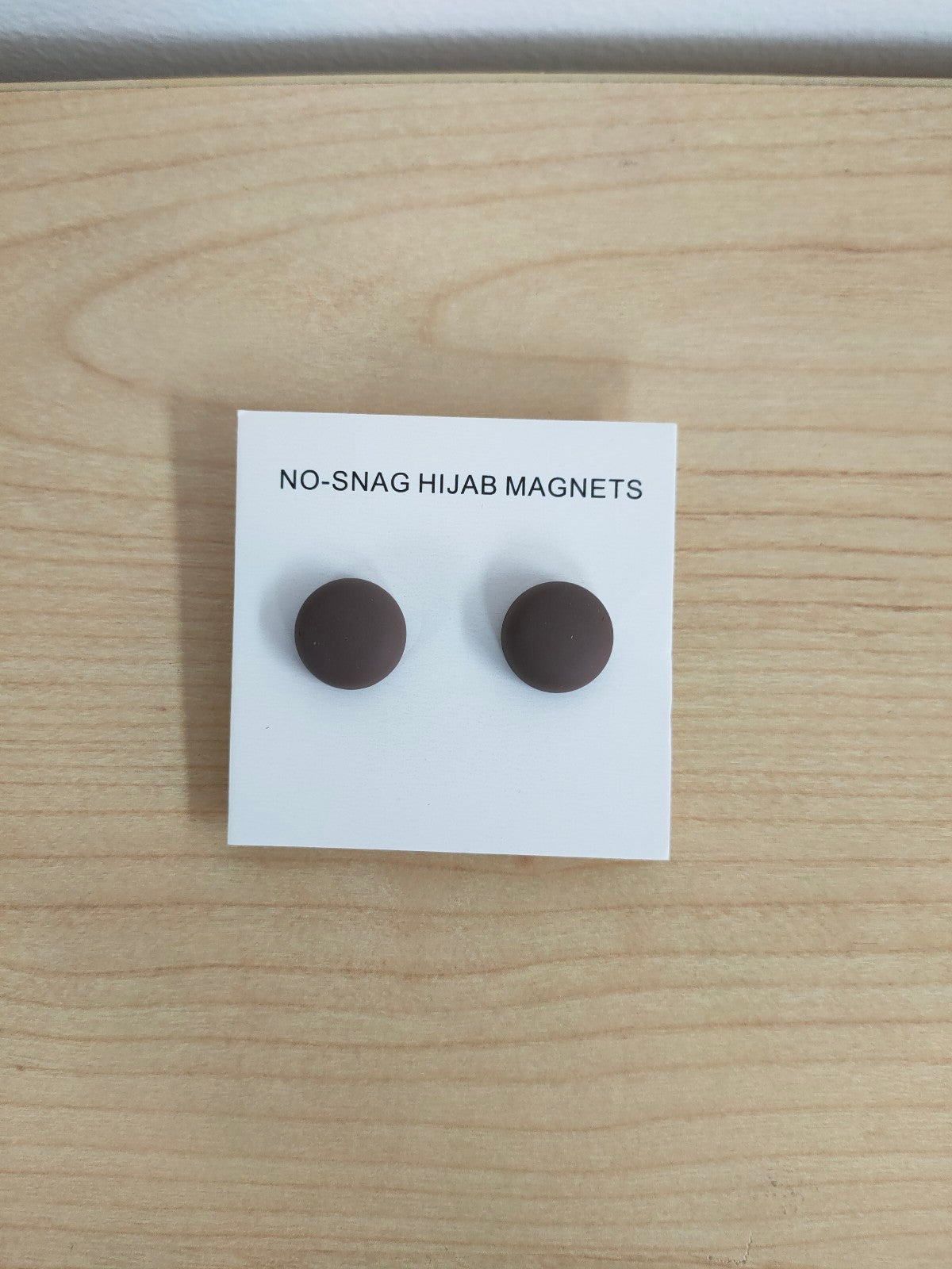 Explore our Hijab Magnets in Coffee Twin-Pack for a stylish and practical way to secure your hijab. Shop now at Hikmah Boutique for elegant magnetic hijab fasteners.