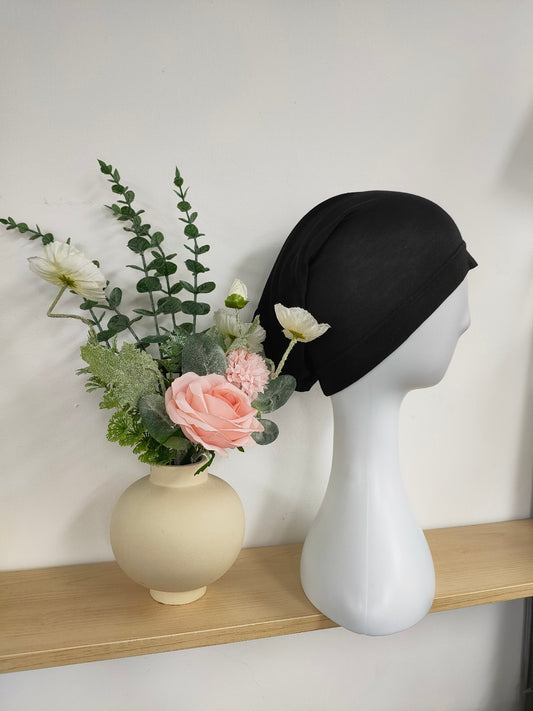 Discover the Hijab Open Undercap in Black at Hikmah Boutique. Perfect for keeping your hijab in place, our high-quality undercap offers comfort and style at a reasonable price. Shop now for the best in modest clothing in Sydney, Australia.