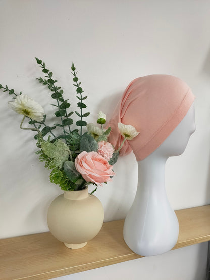 Shop the Hijab Open Undercap in Blossom Pink at Hikmah Boutique. Combining style and comfort, this high-quality undercap is perfect for keeping your hijab in place. Discover the best in modest clothing in Sydney, Australia, at a reasonable price.