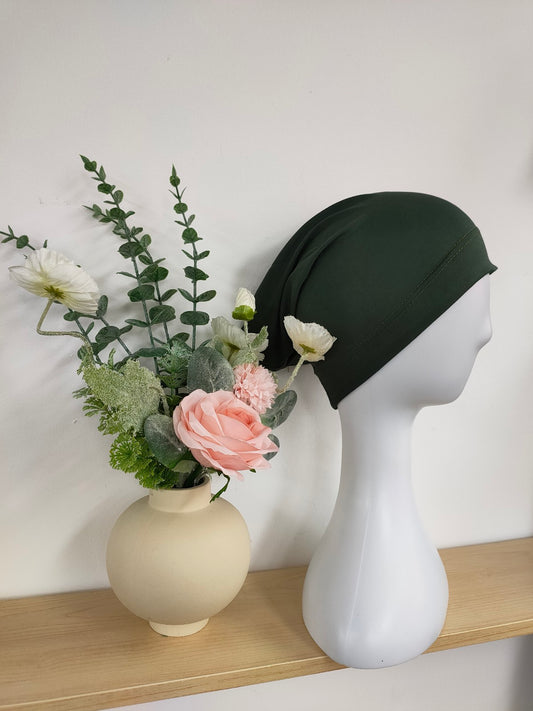 Shop the Hijab Open Undercap in Dark Green at Hikmah Boutique. Offering timeless elegance and comfort, this high-quality undercap keeps your hijab in place. Discover the best in modest clothing in Sydney, Australia, at a reasonable price.