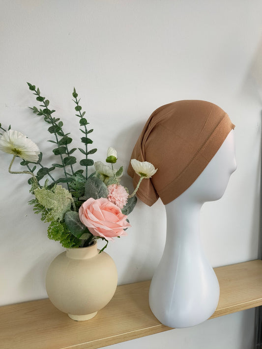 Shop the Hijab Open Undercap in Dusty Coffee at Hikmah Boutique. Combining sophistication and comfort, this high-quality undercap keeps your hijab in place. Discover the best in modest clothing in Sydney, Australia, at a reasonable price.