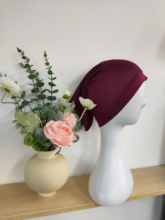 Shop the Hijab Open Undercap in Maroon at Hikmah Boutique. Combining elegance and comfort, this high-quality undercap keeps your hijab in place. Discover the best in modest clothing in Sydney, Australia, at a reasonable price.
