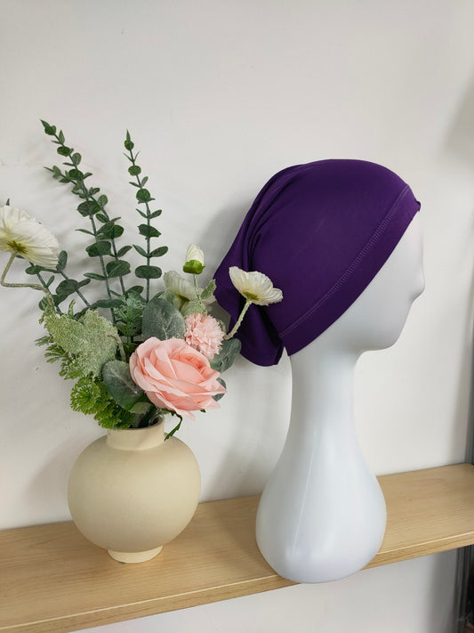 Shop the Hijab Open Undercap in Purple at Hikmah Boutique. Combining sophistication and comfort, this high-quality undercap keeps your hijab in place. Discover the best in modest clothing in Sydney, Australia, at a reasonable price.