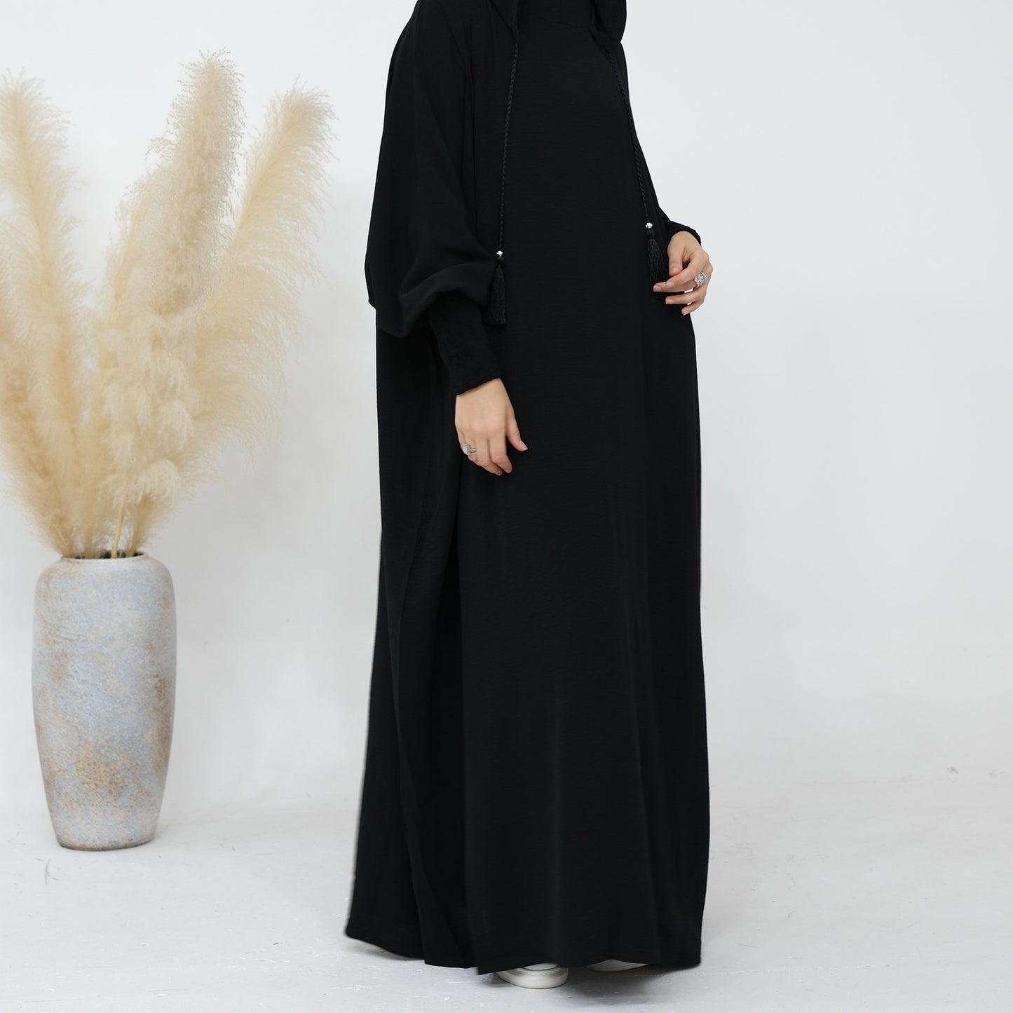 Elevate your modest wardrobe with our exclusive Hooded Jilbab Abaya in Black, meticulously designed and exclusively sold by Hikmah Boutique. Combining the elegance of a traditional Abaya with the functionality of a Hooded Jilbab.