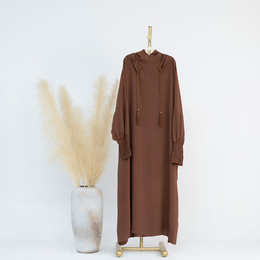 Introducing our Chocolate Brown Hooded Jilbab Abaya, a symbol of timeless elegance and modesty, exclusively available at Hikmah Boutique. Crafted with meticulous attention to detail, this exquisite garment is designed to elevate your modest wardrobe with grace and sophistication.