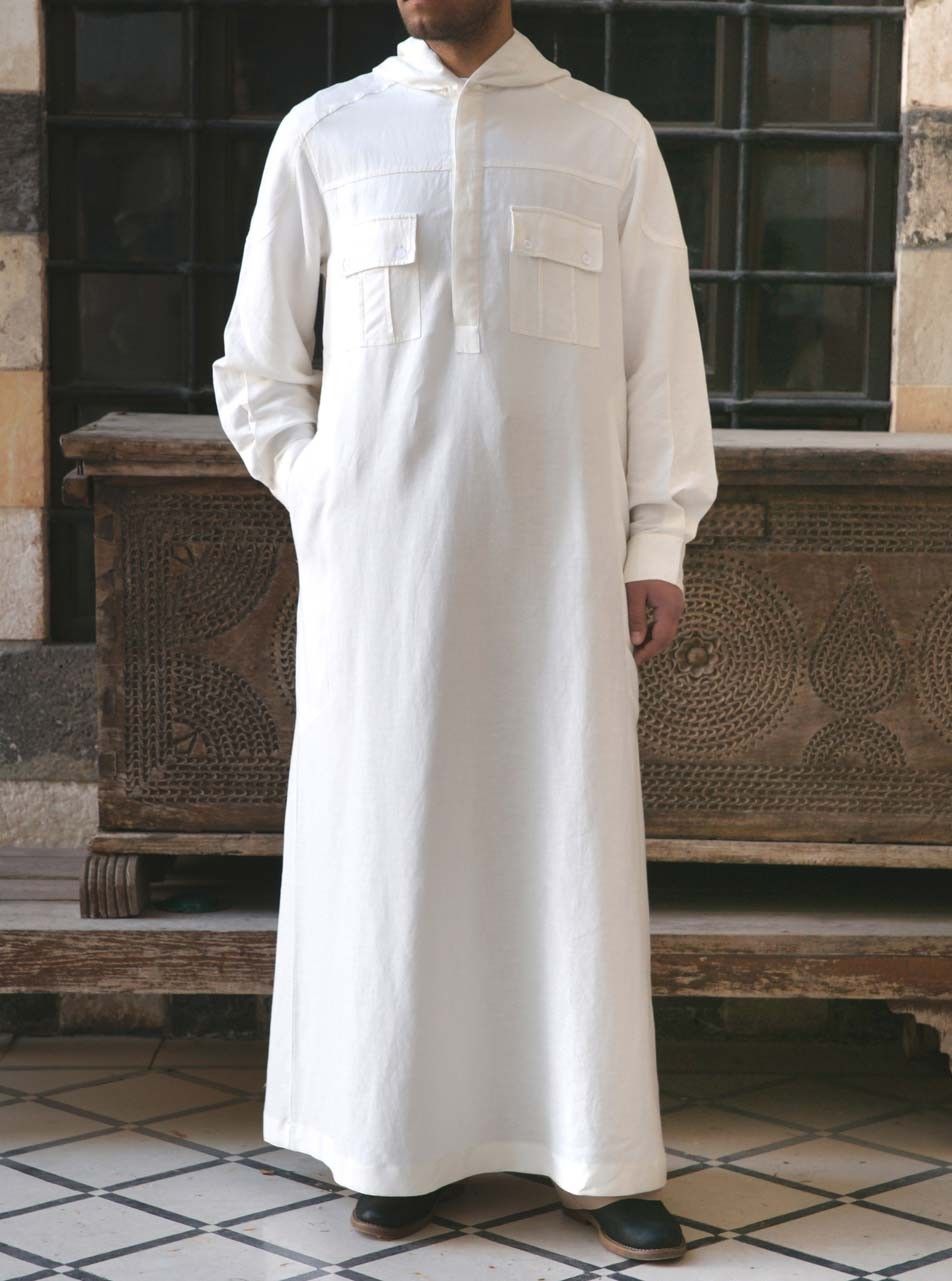 Introducing our exclusive Hooded Men's Thobe in White, available only at Hikmah Boutique. This remarkable piece combines traditional thobes for men with contemporary designer elements, catering to the modern man seeking a unique and stylish look. Shop our Hooded Men's Thobe only at Hikmah Boutique. Online or In-store