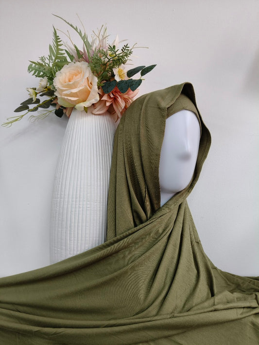 Shop our premium Jersey Hijab in Olive Green at Hikmah Boutique. Discover soft, comfortable, and stylish Jersey hijabs perfect for any occasion. Affordable and lightweight Jersey Hijabs, ideal for summer and sports. Visit our online hijab shop today!