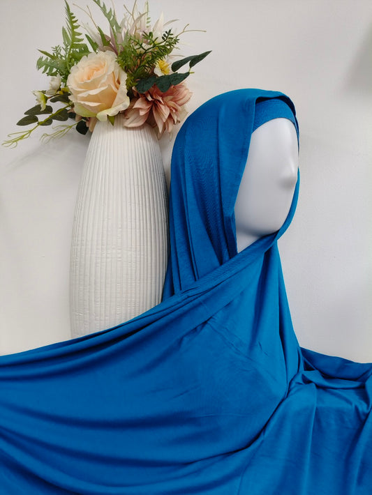 Discover the ultimate in comfort and style with our Premium Jersey Hijab in Teal. Shop soft, lightweight, and stretch jersey hijabs for summer and sports at Hikmah Boutique. Your go-to online hijab shop for affordable, stylish, and premium modest clothing.