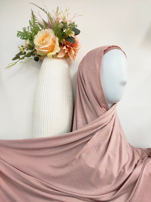 Discover our premium Jersey Hijab in Dusty Pink at Hikmah Boutique. Soft, stretchable, and lightweight, perfect for summer and sports. Shop stylish, affordable hijabs online from the best hijab shop and modest clothing store.