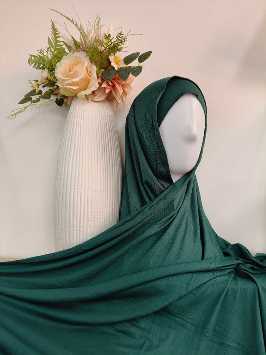 Shop our premium Jersey Hijab in Emerald Green at Hikmah Boutique. Discover soft, comfortable, and stylish Jersey hijabs perfect for any occasion. Affordable and lightweight Jersey Hijabs, ideal for summer and sports. Visit our online hijab shop.