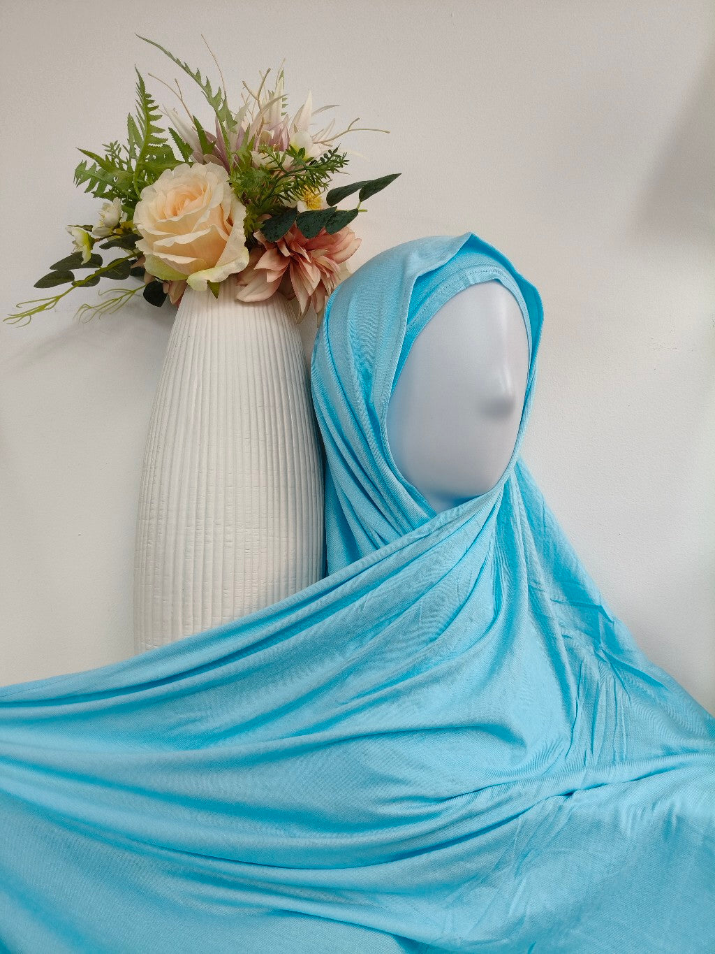 Discover our Light Blue Jersey Hijab at Hikmah Boutique. Soft, stretchable, and stylish hijabs perfect for summer. Shop now for affordable premium hijabs online!