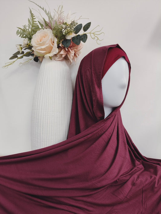 Discover our premium Maroon Jersey Hijab at Hikmah Boutique. Soft, comfortable, and perfect for summer. Shop now at the best online hijab shop for stylish and affordable modest clothing.