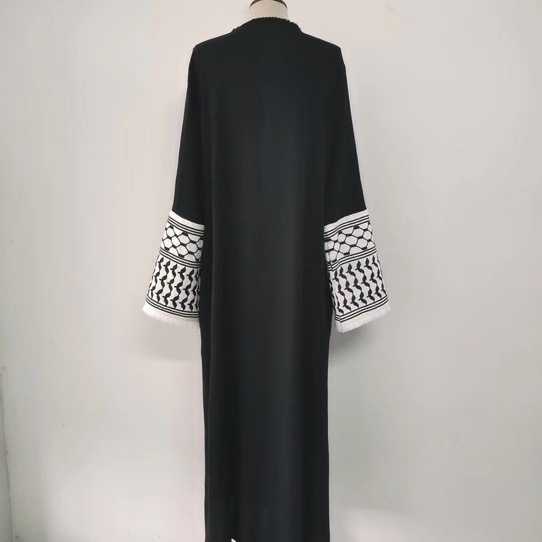 Make a bold statement with our stunning Black Keffiyeh Sleeve Open Abaya from Hikmah Boutique. A timeless piece that effortlessly combines style and modesty.