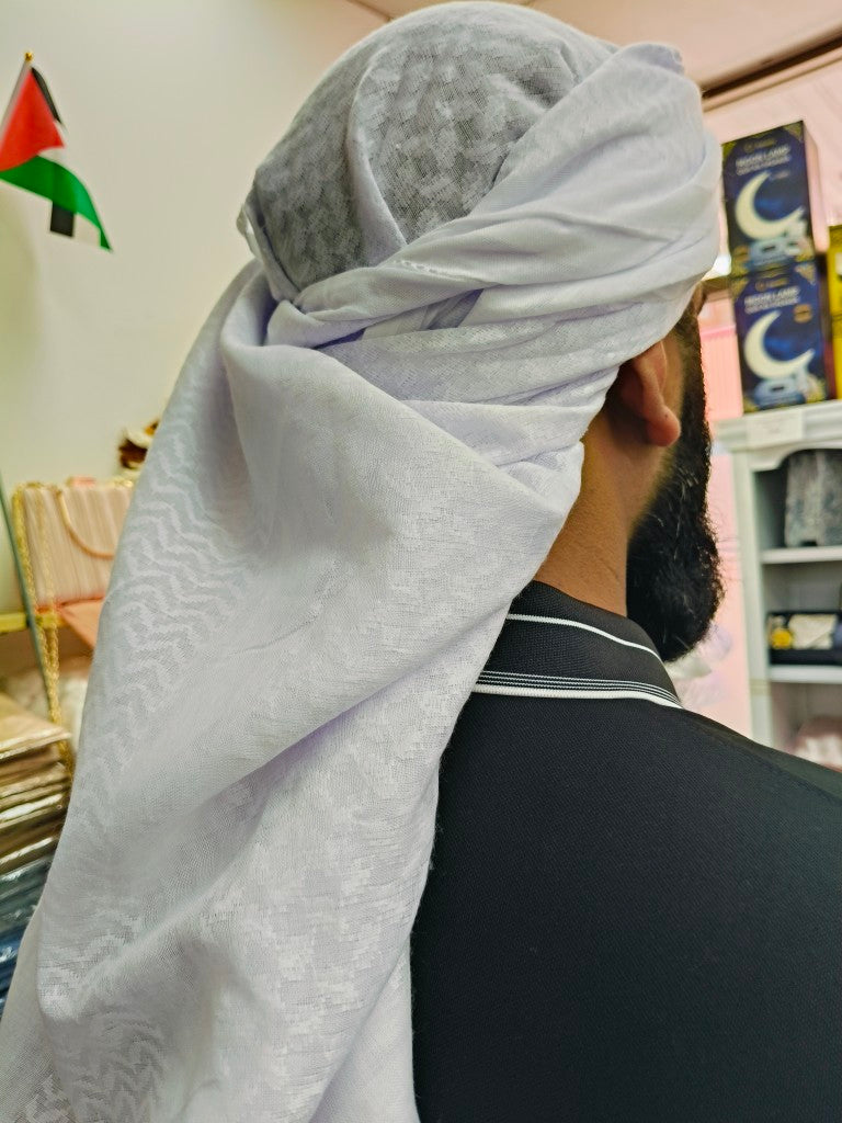 Explore Hikmah Boutique's Exclusive White Keffiyeh Scarf. Explore the timeless elegance of our meticulously crafted scarf, blending Palestinian tradition with contemporary flair. Discover the best quality White Shemagh options for men and women. Shop now for authentic Middle Eastern heritage at Hikmah Boutique.