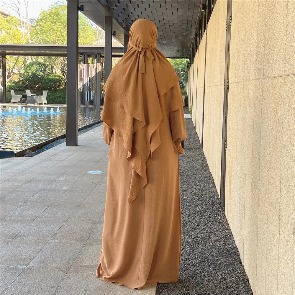 Shop Modest Clothing with our Khaki Crepe Crinkle Abaya with Double Layer Khimar Set – Exclusive Modesty at Hikmah Boutique Indulge in the sophisticated simplicity of our Khaki Crepe Crinkle Abaya with Double Layer Khimar Set, an emblem of modesty and elegance exclusively available at Hikmah Boutique.