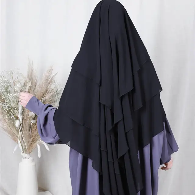 Introducing the stunning Khimar from Hikmah Boutique - a must-have addition to your wardrobe! This beautiful piece of clothing is perfect for women who are looking for a stylish and modest way to dress. Made with three layers of high-quality material, the Khimar offers excellent coverage and comfort. 