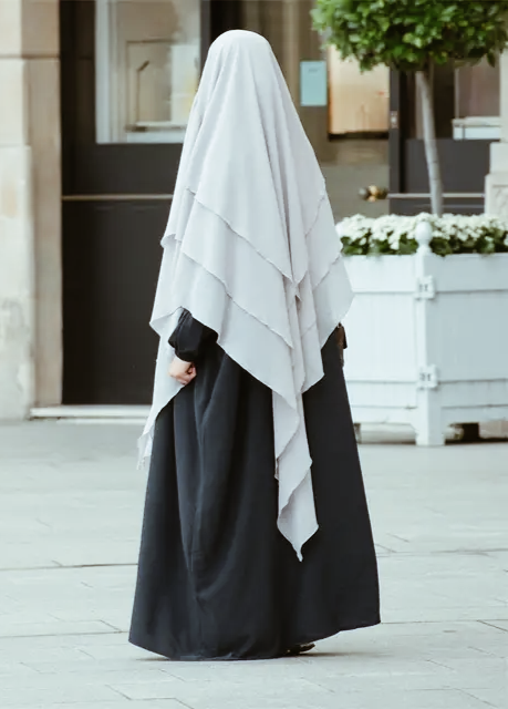 Introducing the stunning Khimar from Hikmah Boutique - a must-have addition to your wardrobe! This beautiful piece of clothing is perfect for women who are looking for a stylish and modest way to dress. Made with three layers of high-quality material, the Khimar offers excellent coverage and comfort. 