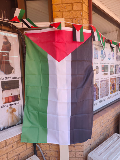 Show your support with our Large Palestine Flag from Hikmah Boutique. Measuring 150cm by 90cm, this premium-quality flag is a symbol of solidarity and pride. Elevate your space with this authentic representation of Palestinian heritage. Order now for a meaningful addition to your collection.