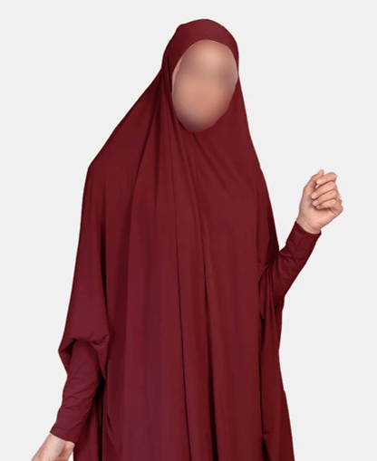 Indulge in the enchanting allure of our Lightweight Maroon Jilbab, a masterpiece exclusively crafted by Hikmah Boutique. This exquisitely designed jilbab embodies the essence of elegance and comfort, elevating your modest style to new heights. Wrapped in a rich maroon hue, our Lightweight Jilbab shows timeless sophistication.
