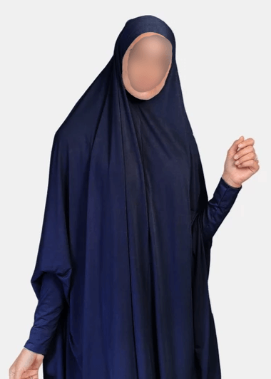 Indulge in the essence of refined fashion with our Lightweight Navy Jilbab, an exquisite creation curated exclusively by Hikmah Boutique. Graceful and enchanting, this jilbab is thoughtfully designed to elevate your modest style while embracing ultimate comfort. A Captivating Presence: Wrapped in a luxurious navy Jilbab.