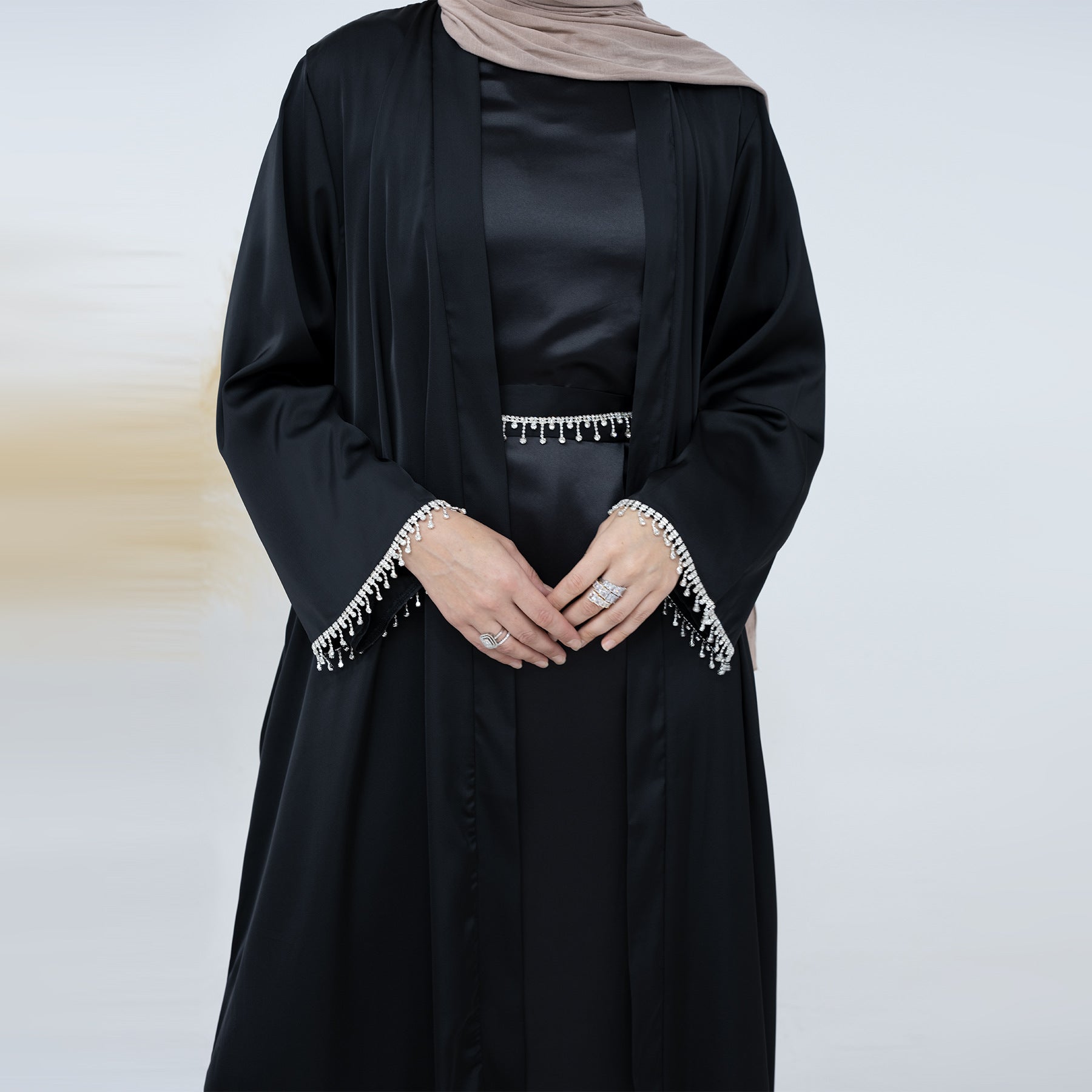 Discover sophistication and grace with the Malika Abaya in Black, exclusively available at Hikmah Boutique. Crafted from luxurious Satin silk material, this timeless abaya provides comfort and modesty. Elevate your modest clothing with our versatile 4-piece abaya set, perfect for Eid, Wedding and all occasions.