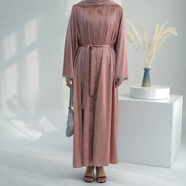 Elevate your modest wardrobe with the Malika Abaya in Blossom Pink from Hikmah Boutique. Crafted from luxurious satin silk, this exquisite abaya exudes sophistication and grace. Shop now for timeless modest clothing elegance!