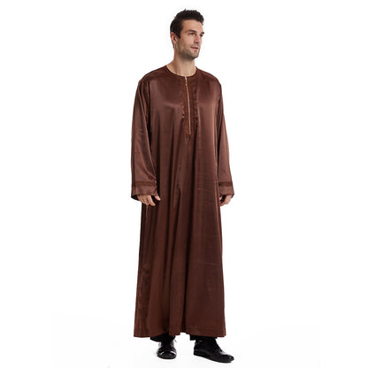 Hikmah Boutique's exquisite Men's Abaya Full Sleeves in Coffee, meticulously crafted to embody elegance and comfort synonymous with Islamic clothing for men. Each piece is a fusion of tradition and contemporary Modest Clothing fashion.