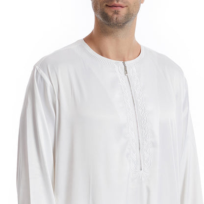 Hikmah Boutique's exclusive Men's Abaya Full Sleeves in White. Handcrafted with meticulous attention to detail and using premium materials, this abaya offers a seamless blend of elegance and comfort, catering to the discerning tastes of Muslim Men seeking Islamic clothing that exudes Modest Clothing refinement.