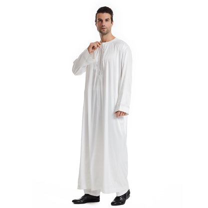 Hikmah Boutique's exclusive Men's Abaya Full Sleeves in White. Handcrafted with meticulous attention to detail and using premium materials, this abaya offers a seamless blend of elegance and comfort, catering to the discerning tastes of Muslim Men seeking Islamic clothing that exudes Modest Clothing refinement.