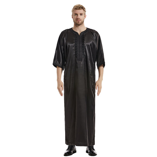 Discover modest Islamic clothing sophistication with our Men's Abaya Half Sleeves in Black. Crafted with premium materials and featuring intricate embroidery, it's the perfect blend of style and modesty. Shop now at Hikmah Boutique.