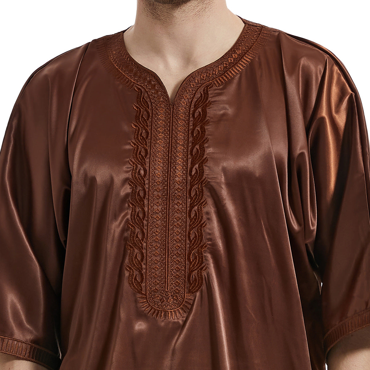 Discover sophistication with our Men's Abaya Half Sleeves in Coffee at Hikmah Boutique. Crafted from premium materials with exquisite embroidery, this abaya offers both style and comfort. Elevate your modest clothing wardrobe with this versatile Islamic attire.