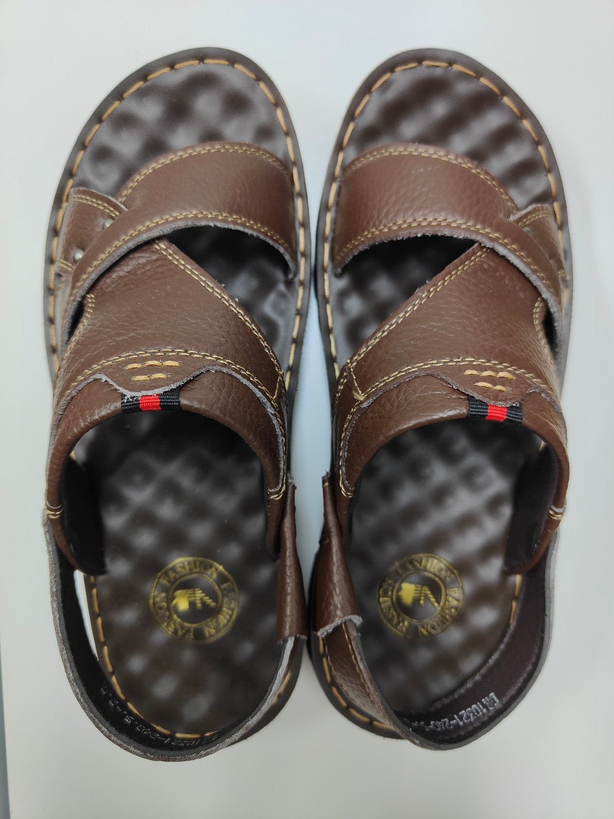 Elevate your style with Dark Brown Design 2 Men's Sandals exclusively from Hikmah Boutique. Crafted with genuine cowhide leather, extra comfort, and an original design. Discover quality and affordability.