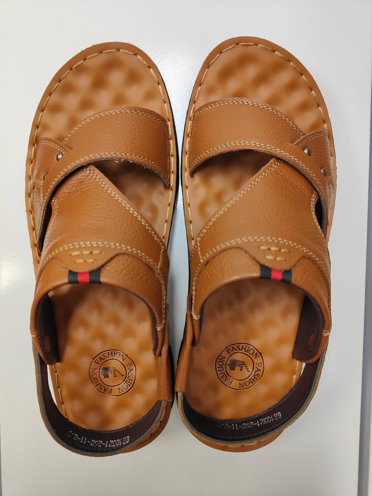 Step into style and comfort with Light Brown Design 2 Men's Sandals exclusively from Hikmah Boutique. Crafted from genuine cowhide leather, featuring customizable heel straps, and an original design. Elevate your fashion game affordably.
