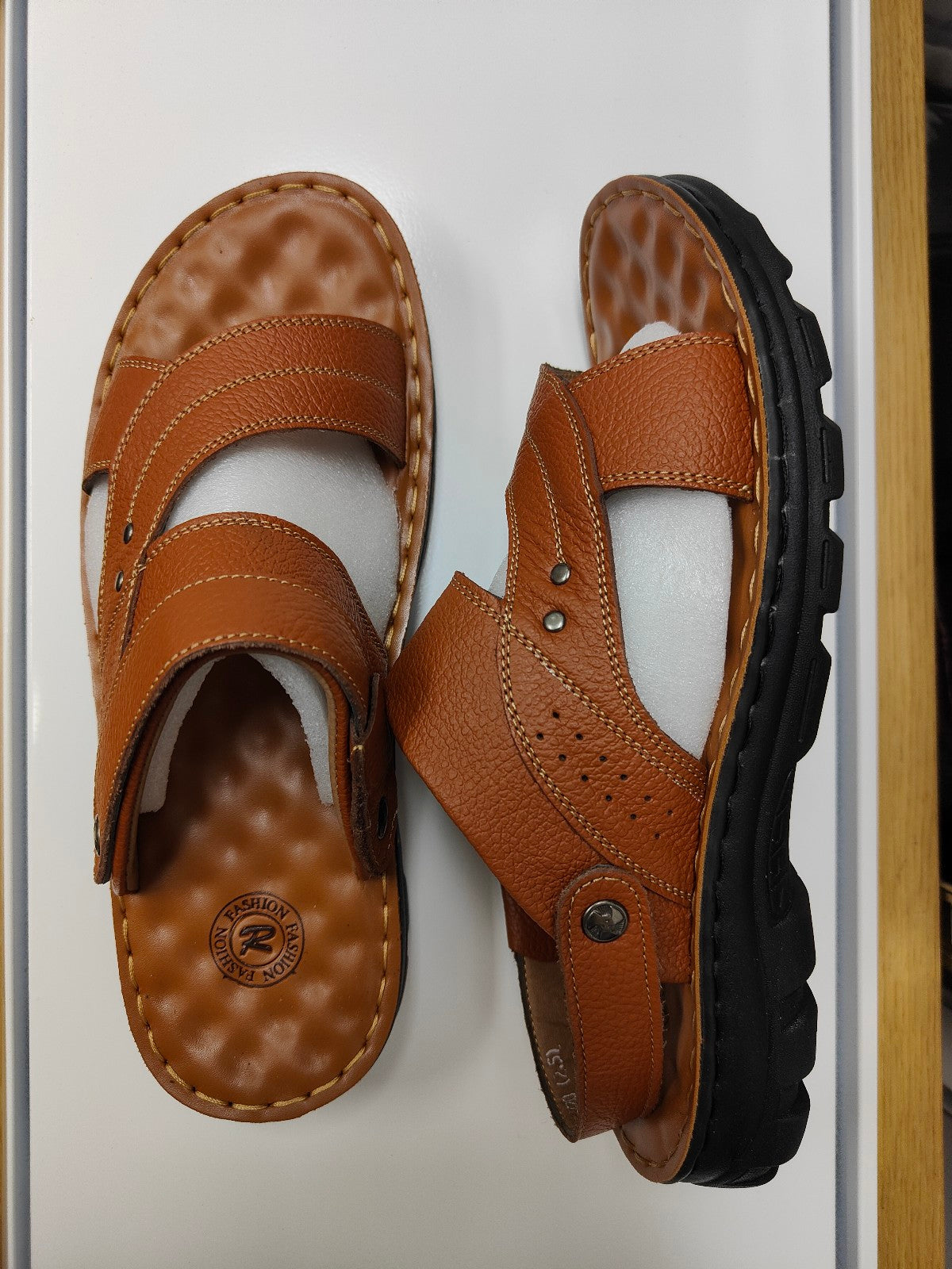 Elevate Your Style and Comfort with Light Brown Design 3 Men's Sandals Introducing the epitome of style, comfort, and quality with our Light Brown Design 3 Men's Sandals, exclusively available at Hikmah Boutique. These sandals are not just footwear; they represent a seamless blend of elegance, comfort, and durability.