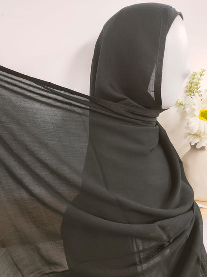 Shop now for our timeless double stitched Modal Hijab in classic Black, a versatile essential for your hijab collection, available at Hikmah Boutique! This Modal Hijab crafted from premium modal fabric, known for its softness and breathability, for comfort and style all day long. Based in Australia, deliver worldwide.