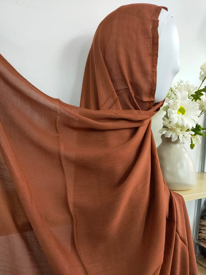 Introducing our sophisticated Modal Hijab in Dark Caramel, a timeless choice for the discerning modest woman, at Hikmah Boutique! Crafted with precision from premium modal fabric, cherished for its gentle touch and breathability, this modal hijab promises enduring comfort and style. Based in Australia, Deliver Worldwide.