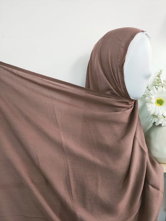 Shop now for our Modal Hijab in Dusty Mocha, a sophisticated addition to your hijab collection, available at Hikmah Boutique! made premium modal fabric, known for its luxurious softness and breathability, this modal hijab ensures comfort and style that lasts all day. Based in Australia, Deliver Worldwide. 