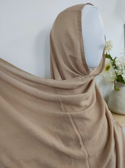 Shop now for our versatile Modal Hijab in Khaki, a must-have addition to your hijab collection, available at Hikmah Boutique! Expertly crafted from premium modal fabric, known for its luxurious softness and breathability, this modal hijab ensures comfort and style that lasts all day. Based in Australia, Deliver Worldwide.