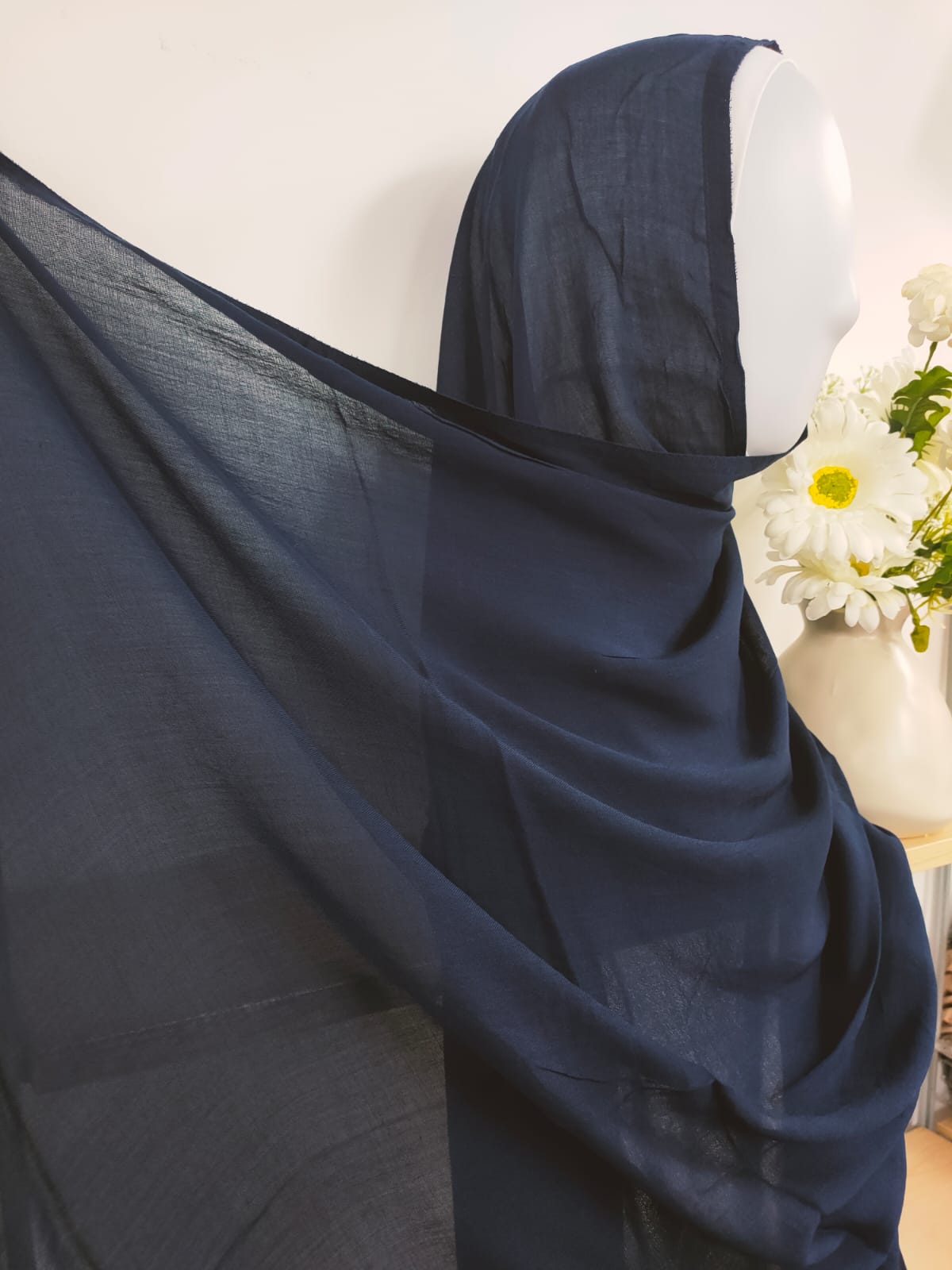 Shop now for our refined Modal Hijab in Navy, a timeless essential for your hijab collection, exclusively available at Hikmah Boutique! Carefully crafted from premium modal fabric, renowned for its luxurious softness and breathability, this hijab ensures all day comfort and style. Based in Australia, Deliver Worldwide. 