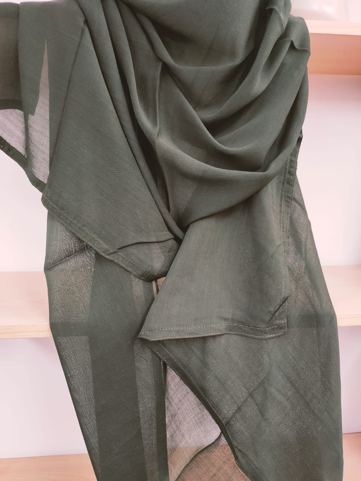 Introducing our exquisite Modal Hijab in Olive Green, a sophisticated choice for the discerning modest woman, at Hikmah Boutique! Crafted with precision from premium modal fabric, cherished for its gentle touch and breathability, this modal hijab promises enduring comfort and style. Based in Australia, Deliver Worldwide. 