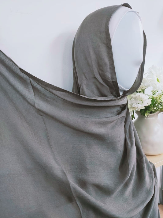 Introducing our refined Pearl Grey Modal Hijab, a timeless choice for modest women, available exclusively at Hikmah Boutique! Crafted with precision from premium modal fabric, cherished for its gentle touch and breathability, this modal hijab promises enduring comfort and style. Based in Australia, Deliver Worldwide.