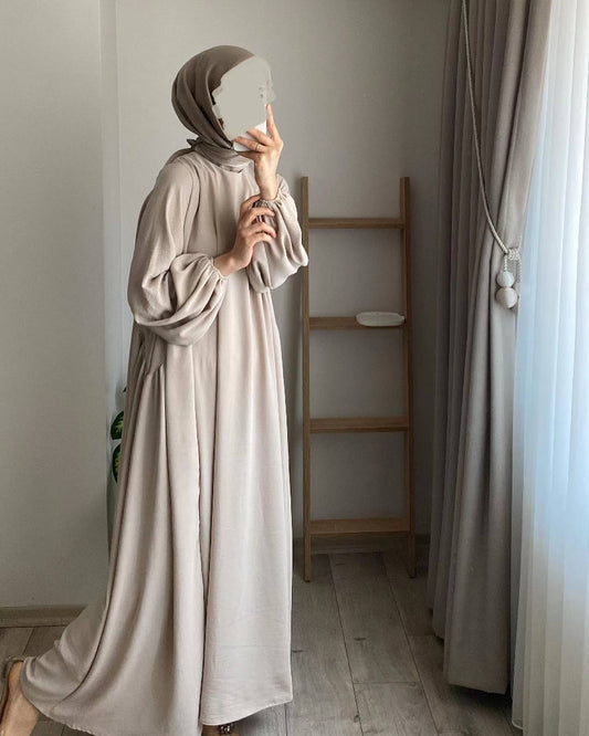 Discover the Loose Design Crepe Abaya in Cream Beige at Hikmah Boutique. This elegant and versatile abaya is perfect for any occasion. Shop online in Australia today!