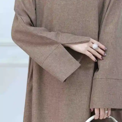 Find the Modest Plain Abaya in Dusty Brown at Hikmah Boutique Australia. Neutral design, modest fit, and affordable prices. Available in all sizes.