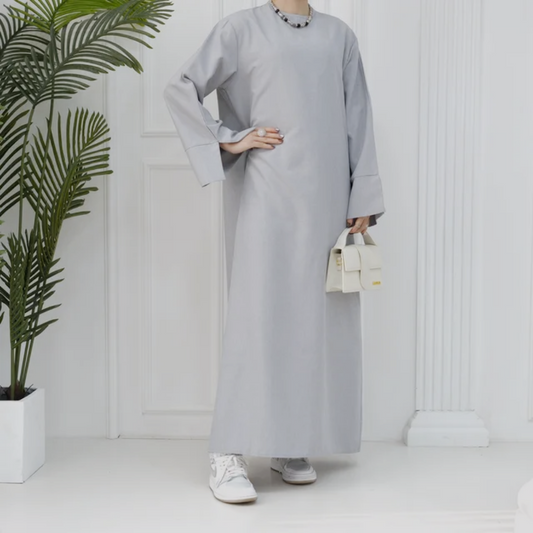 Explore the Modest Plain Abaya in Silver Grey at Hikmah Boutique Australia. Stylish, neutral design with a modest fit. Available in all sizes at a great price.