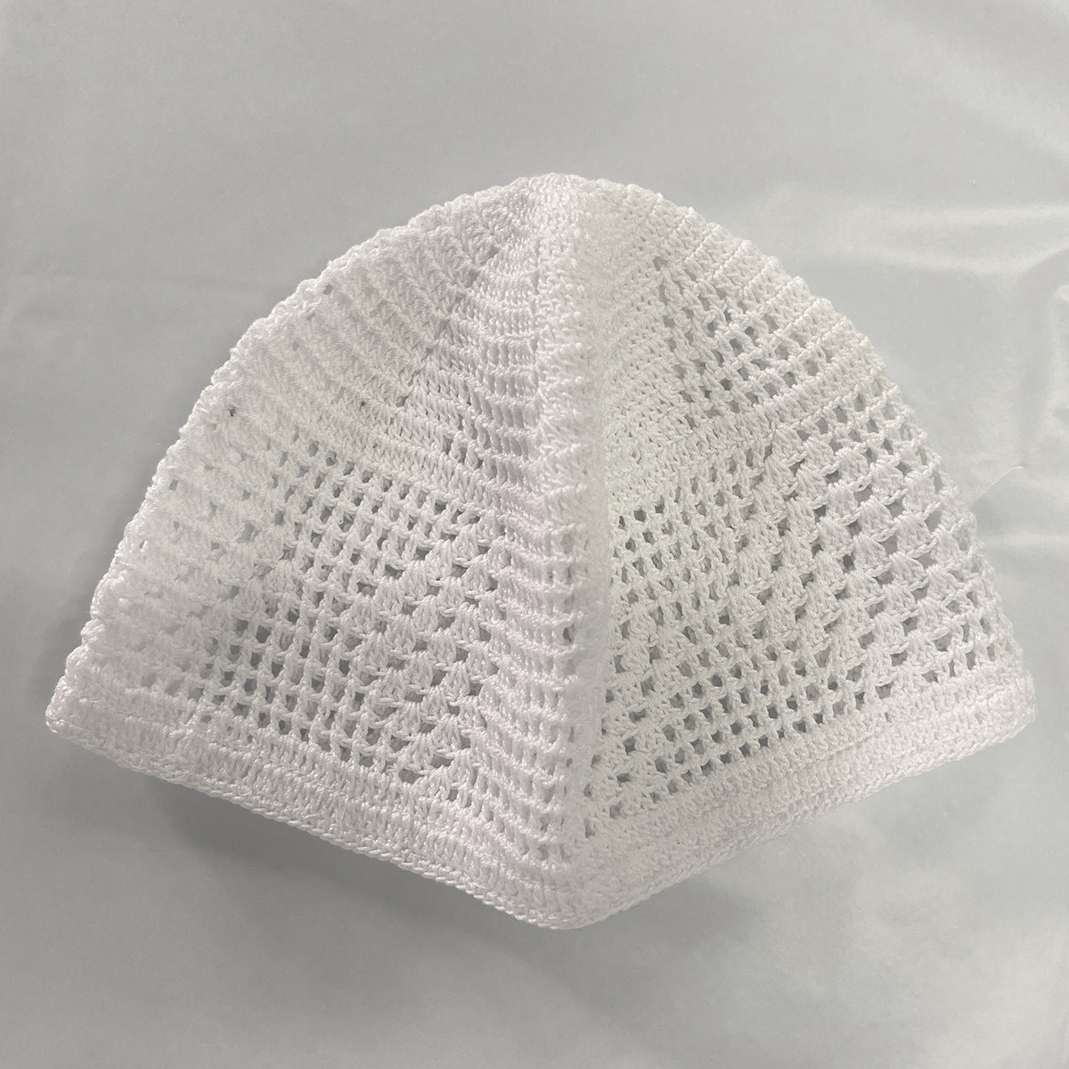 Discover serenity in prayer with Hikmah Boutique's White Muslim Prayer Cap. Hand-crafted from premium cotton, this elastic cap combines comfort and style. Experience cultural richness with subtle Kufi-inspired designed. Elevate your spiritual journey with our exclusive, lightweight prayer cap.