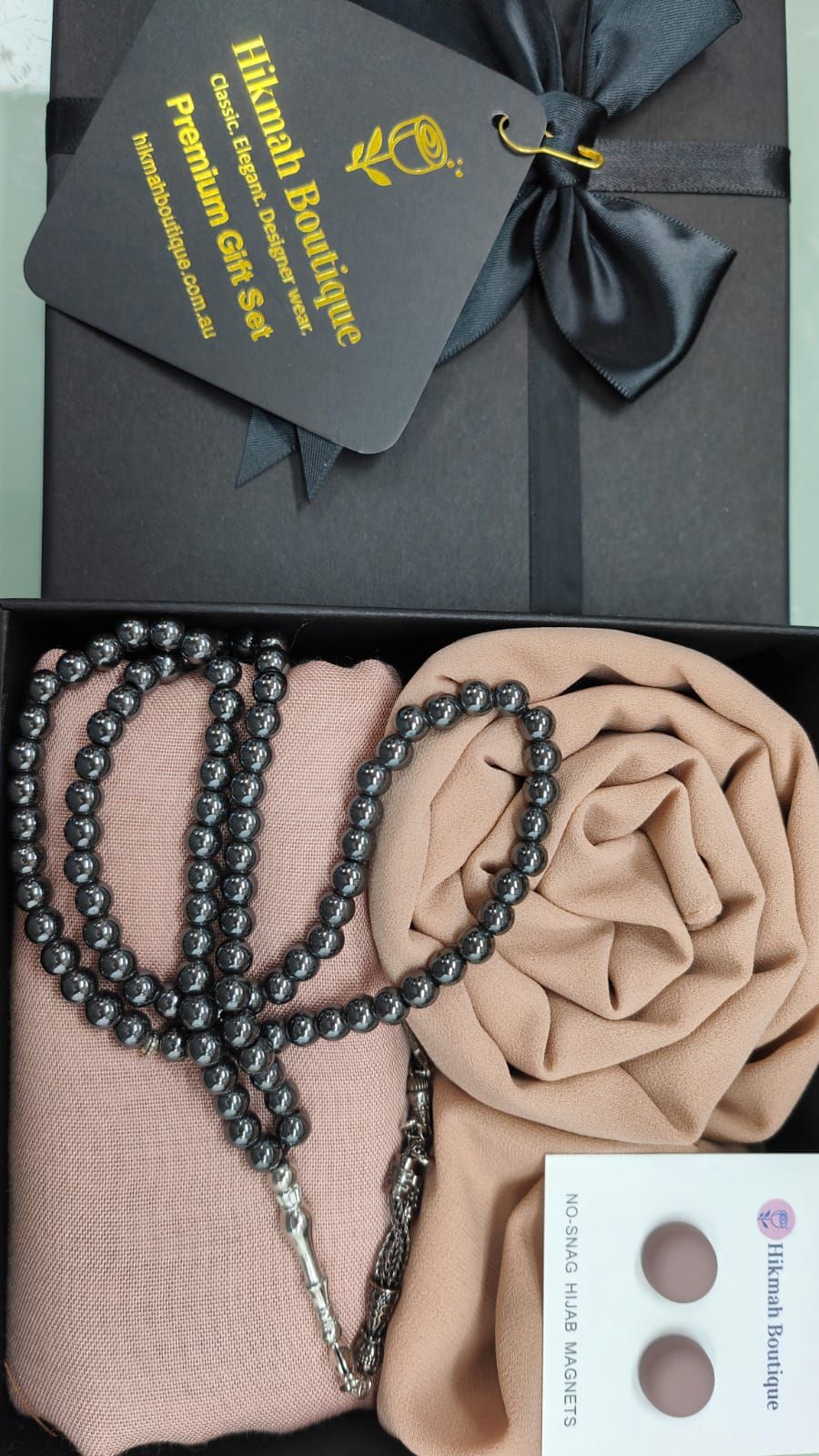 Discover elegance with our My First Hijab Gift Box. Premium chiffon and viscose hijabs, matching magnetic pins, Tasbih in a beautifully designed gift box. The perfect gift for new reverts or Muslimah.