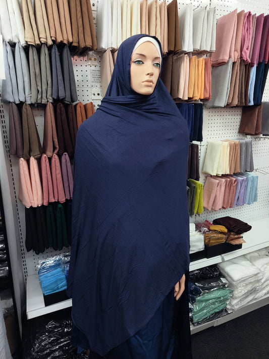 Discover our Navy Jersey Hijab at Hikmah Boutique. Experience comfort with our soft and stretchy hijabs, perfect for summer. Shop now for stylish jersey hijabs online!