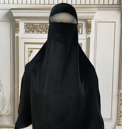 Introducing Hikmah Boutique's Niqab, a modest designs perfect for those seeking a modest yet Elegant look. Our Niqab features single layer, tie up option. This Niqab is long and wide, the length of this niqab is 60cm from under eyes. Niqab's width is 50cm from the spot under eyes, increased to 70cm the bottom width.